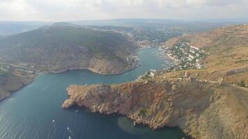 Drone view of steep cliffs and the remains of a ruined fortress video