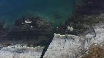 View from the drone vertically down to the ocean in calm weather video