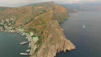 Drone view of steep cliffs and the remains of a ruined fortress video