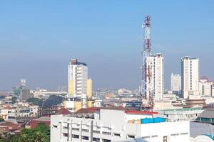 Bandung, Indonesia, 2024 - Telecommunication tower in the middle of suburban area in Bandung, West Java photo