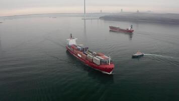 Drone view of the a pilot boat and container vessel in motion video