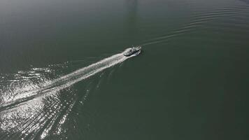 Drone view of a tugboat in motion on the water video