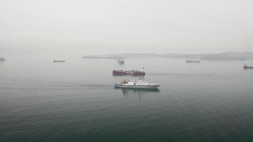 Drone view of the a container vessel and rescue ship in motion video