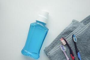 mouthwash liquid in a container on table photo