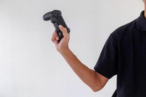 Man holding a gamepad controller or joystick on a white background photo