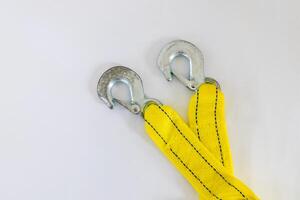 Yellow tow rope with hooks on a white background photo
