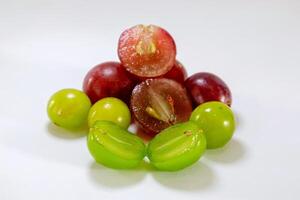 Fresh red and green grapes isolated on a white background photo