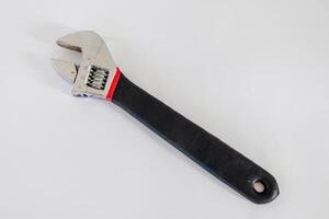 An adjustable spanner or adjustable wrench isolated on white background photo