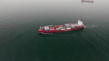 Aerial view of the a container vessel in motion video
