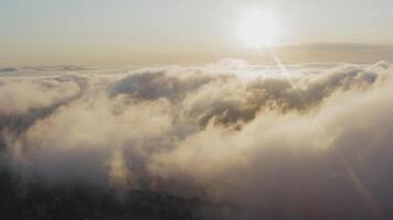 View from a drone of city center, above which clouds are rapidly floating video