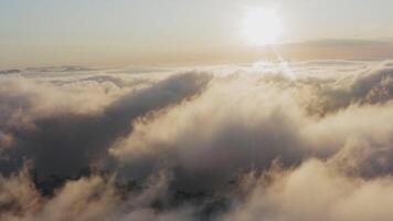 View from a drone of city center, above which clouds are rapidly floating video