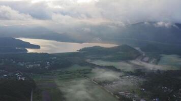 Aerial drone view of sunrise over misty river video