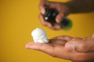top view of shaving foam on hand photo