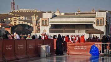 Medina, Saudi Arabia on March 1, 2024. Queues of female Umrah pilgrims from all over the world line up to enter Raudhah photo