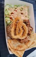 The food was bought from Doner Kebab, which contained briyani rice, roti canai, photo