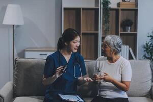Doctor consulting with patient discussing something and Presenting results on report, Medicine and health care concept. photo