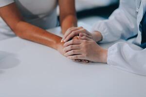 doctor holding patient's hand Cheer and encourage while checking your health. Trust your health and mind. photo
