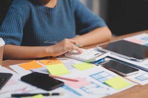 The designer team is designing the uxui system to make the uxui system work well on new phones and support system updates. Website development concept UI UX front end designer photo