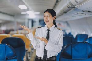 Portrait of a trained airplane captain in uniform preparing to fly, event planning in airplane. photo