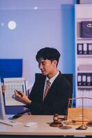 Judge gavel with Justice lawyers having team meeting at law firm background. Concepts of Law and Legal services. photo