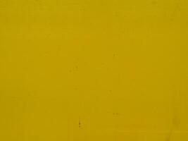 Yellow painted steel texture for a close-up background of a building or construction. photo