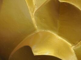 Golden texture at Buddhist temple, close-up for abstract background. photo
