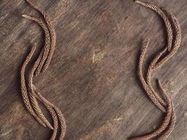Pine leaves on old brown wood background, vintage style for copy space. photo