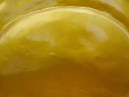 Golden texture at Buddhist temple, close-up for abstract background. photo