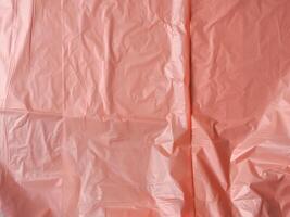 Old rose colored plastic bag texture for abstract background. photo
