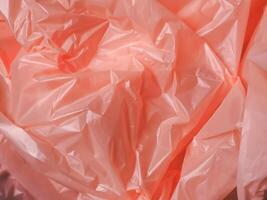 Old rose colored plastic bag texture for abstract background. photo