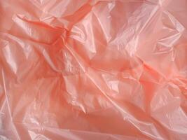 Old rose colored plastic bag texture for abstract background. photo