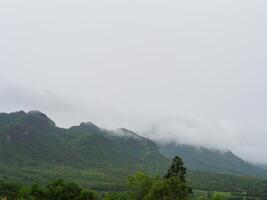 Fog on the mountains in the rainy season photo