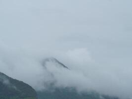 Fog on the mountains in the rainy season photo
