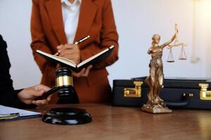 Lawyer, legal advisor, businessman brainstorming information on agreement details Business contracts in legal processing books for accuracy in contract documents. joint financial investment. photo