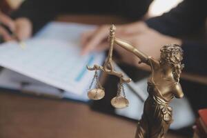 Lawyer, legal advisor, businessman brainstorming information on agreement details Business contracts in legal processing books for accuracy in contract documents. joint financial investment. photo