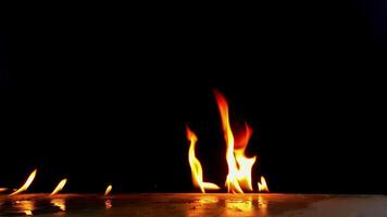 Flames are burning isolated on a black background. Concept of particles, sparkles, flame and light. video