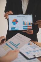 Business people are analyzing and planning business strategies. photo