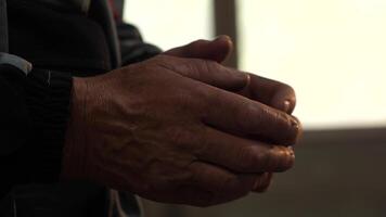 close-up of a worker stretching his tired hands before work video
