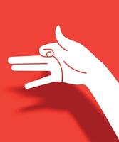 silhouette of hand making shadow game forming a dog on red background vector