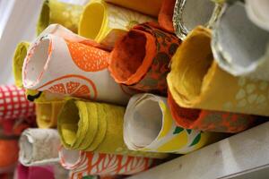 Rolls of Handmade Colorful Papers in a Craft Store photo
