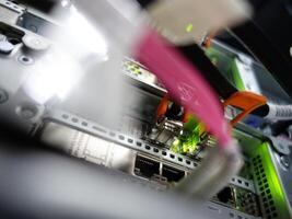network cables connected to switch - closeup of data center hardware technology photo