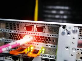 network cables connected to switch - closeup of data center hardware technology photo