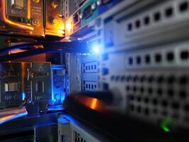 network cables connected to switch - closeup of data center hardware technology photo