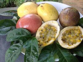 Fresh Passion Fruit with Green Leaves photo