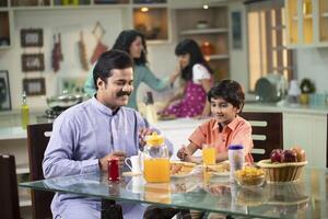 Father and Son Having Breakfast Together photo