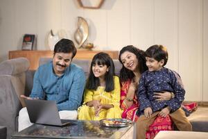 Peaceful Family Talking On Call On Laptop photo