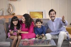 Sibling Playing Games At Home With Parents At Home photo