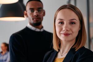 Dynamic Leadership Duo. Blonde Director and Young African American Entrepreneur in Office Setting. photo