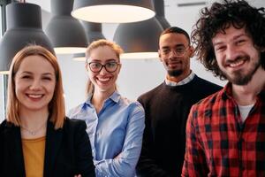 Diverse Business Team Standing United in Modern Office Ready for New Challenges. photo