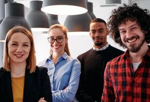 Diverse Business Team Standing United in Modern Office Ready for New Challenges. photo